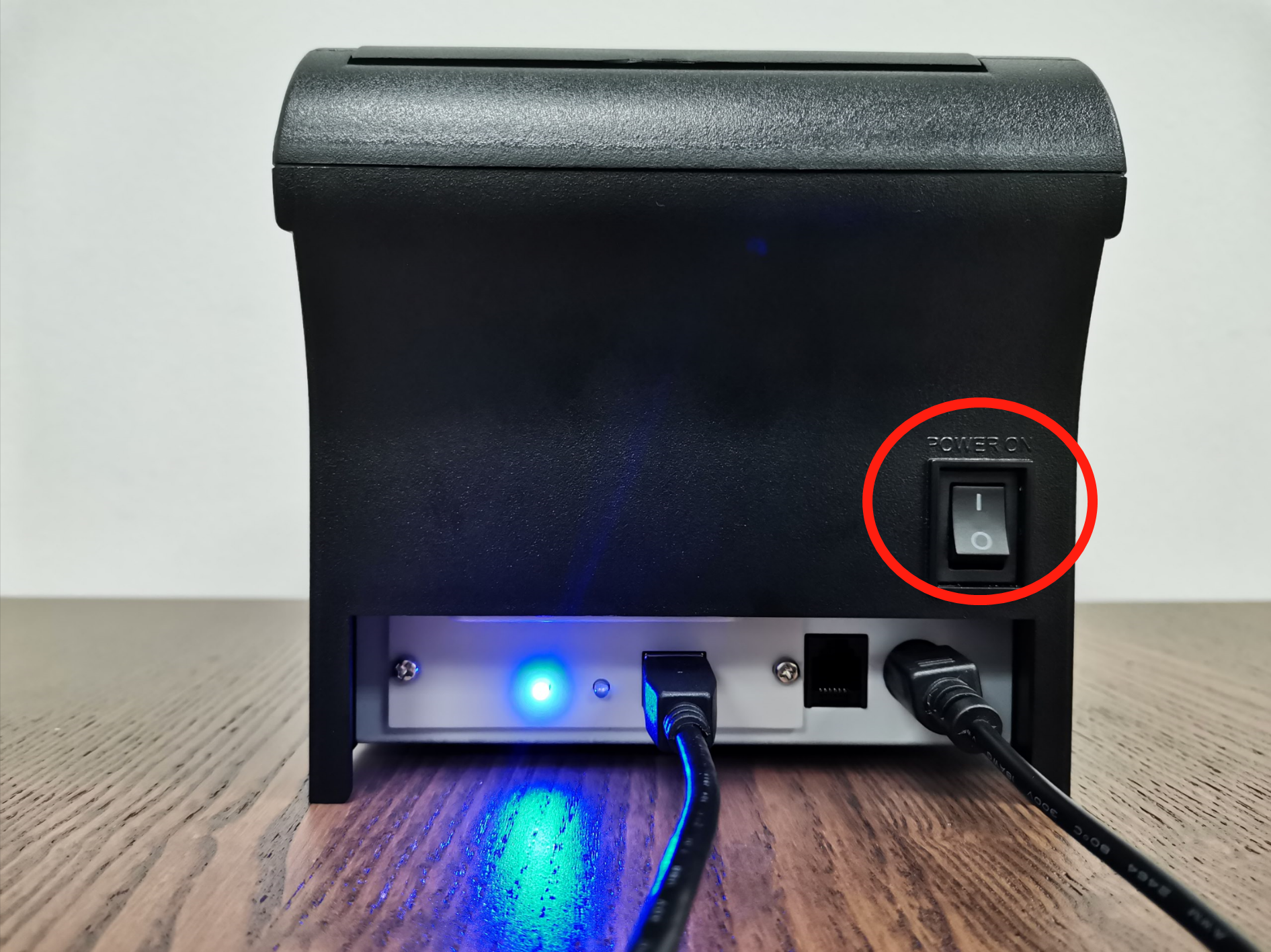 Press the power switch on the back of the receipt printer