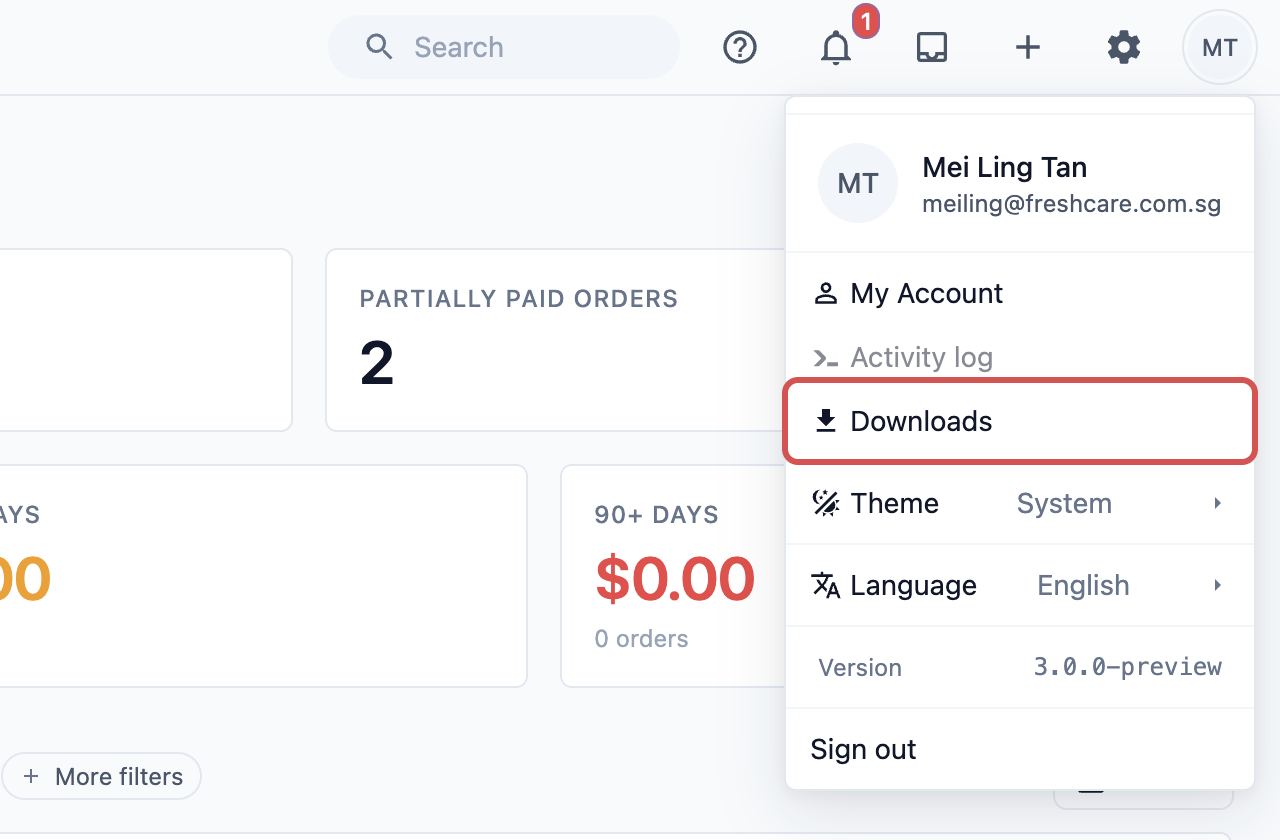 The profile menu open at the top right, with Downloads marked
